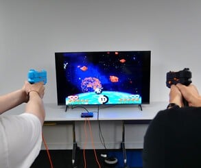 As a rule of thumb, the larger the display, the better the performance. G'AIM'E even works on projectors