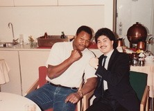 Left: The sell sheet for Punch Out!!, which was designed and conceived by Momoda. Right: images of Momoda, the Nintendo of America team, and Momoda with boxing legend Larry Holmes